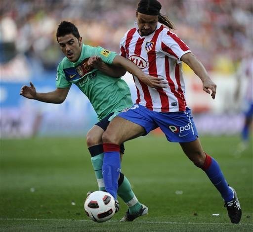 Tomas Ujfalusi, zagueiro do Atl&eacute;tico de Madrid, causou uma les&atilde;o no tornozelo direito do astro argentino