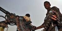Soldado sudanês posa para foto na fronteira com o Sudão do Sul