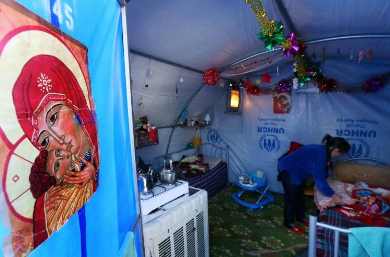 Fugindo da viol&ecirc;ncia no Iraque fam&iacute;lia comemora Natal em abrigo 