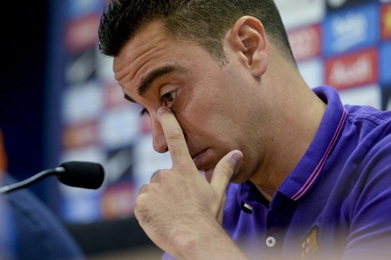 Xavi anuncia sa&iacute;da do Barcelona para defender Al Sadd  
