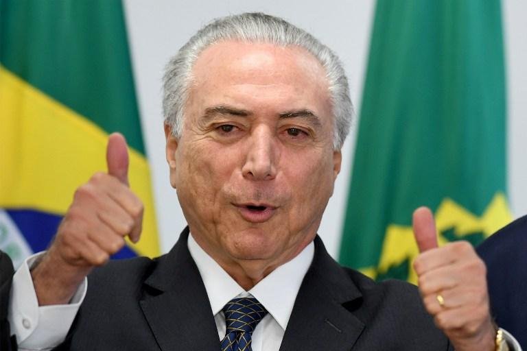 Temer visita ag&ecirc;ncia da Caixa e diz estar "animad&iacute;ssimo" com primeiro ano de governo 