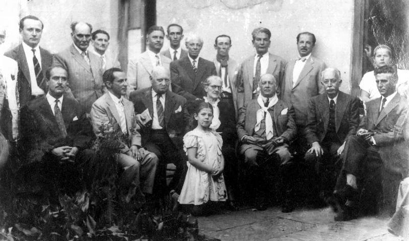 Raul Pilla e Flores da Cunha reunidos com seus correligion&aacute;rios.